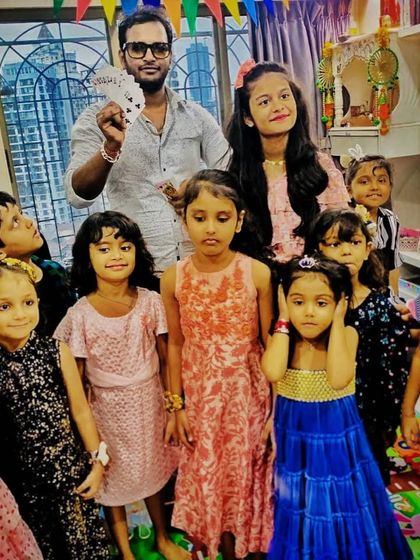 A living room full of amazed faces during a home birthday party. My close-up magic is perfect for intimate settings, creating a personal and mesmerizing experience for all the young guests.