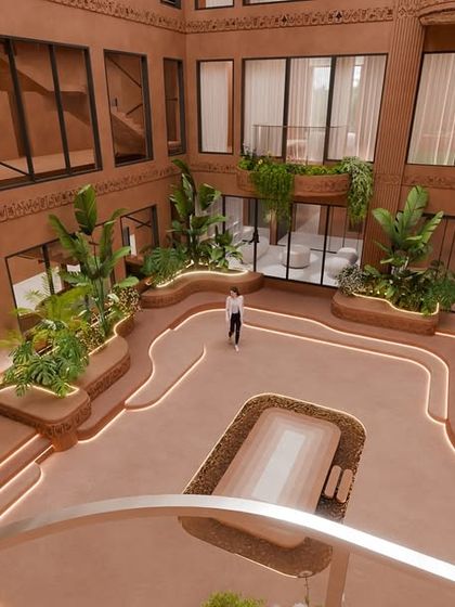 An aerial view of the courtyard, showing the symmetrical layout and the central seating area. The space is designed to invite pause, reflection, and connection.