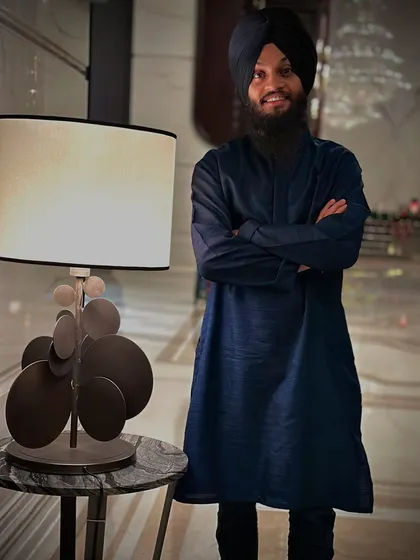 A portrait taken during a concert tour in Gujarat. Even when I am by a lamp, I try to be the brightest in the room with my positivity.