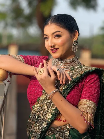 This shot highlights the model's beautiful jewelry. The sleek hairstyle ensures that the focus remains on her accessories and makeup.