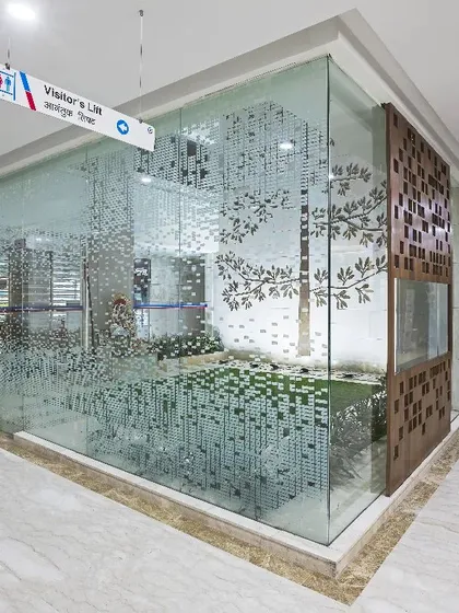 Inspired by Japanese Zen Gardens, the central courtyard at Aakash Super-Specialty Hospital acts as the building's heart. This space, with its water body and greenery, offers a tranquil escape from the clinical environment.