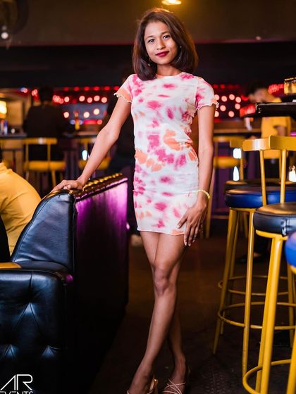 A guest posing at the bar.