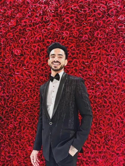 This is my katdana-shower work tuxedo, a modern classic for any formal event. The subtle shimmer of the beadwork on the jacket catches the light, creating a sophisticated and textured look that stands out from a standard black tux.