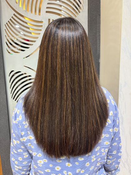The back view of the finished Botox and highlights treatment. The hair is perfectly straight, glossy, and beautifully colored.