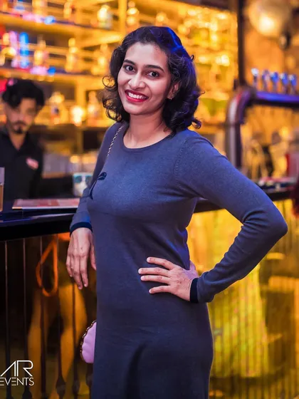 A guest posing by the bar.