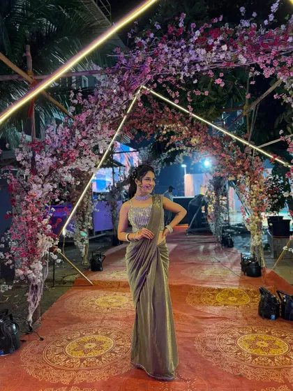 If you want elegance without the effort, I suggest my ready-to-wear sarees. This green shimmer saree comes pre-draped with a stunning sequined blouse, making it a perfect, hassle-free option for wedding guests or parties.