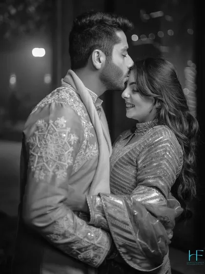 A tender forehead kiss, made even more intimate in black and white. This shot strips away all distractions, leaving only the pure emotion and affection between the couple.
