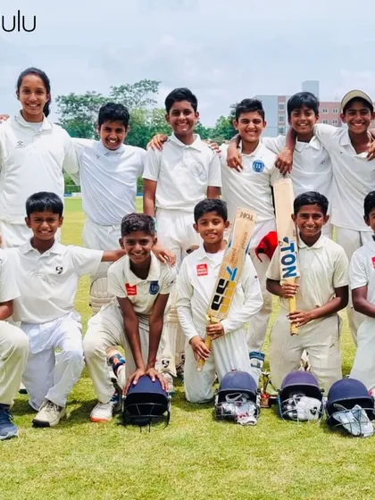 More than just a team, we are a community. Our young cricketers and their coaches pose for a group photo, capturing the spirit of camaraderie and shared goals that we foster at the academy.