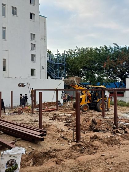Heavy machinery at work during the early stages of the Good Shepherd Cathedral project, clearing and grading the site.