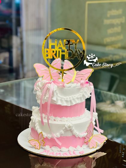 I also offer mini half-kg tiered cakes. This video shows a beautiful pink and white butterfly-themed mini cake, perfect for a small but special birthday celebration.