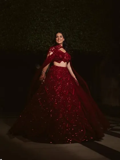 The crimson red lehenga in motion, a perfect blend of classic beauty and contemporary flair for an unforgettable special day.