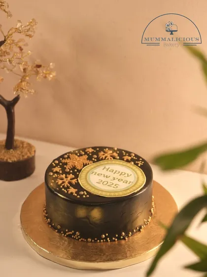 A mini version of our New Year's chocolate truffle cake. This 350gm cake is perfect for a smaller, more intimate celebration to welcome 2025.