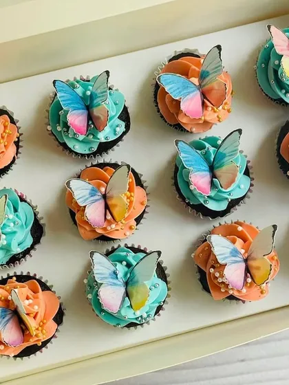 For a more elegant celebration, I create designs like these chocolate mini cupcakes with delicate edible butterflies. The combination of soft peach and baby blue buttercream frosting, dotted with sugar pearls, is perfect for baby showers, birthdays, or sophisticated tea parties.