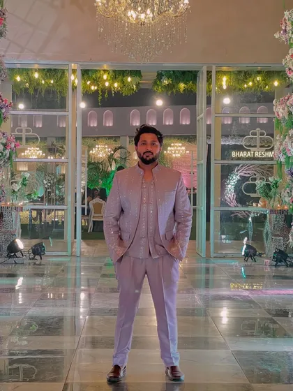 Standing tall and ready to perform. The grand entrance of the venue complements the outfit perfectly.