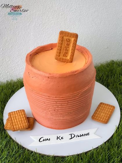 Kulhad chai, anyone? This realistic cake is designed to look like a traditional clay cup of tea, complete with a Parle-G biscuit. It's a fun and nostalgic theme for any chai lover.