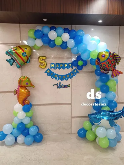 A clear, straight-on photo of the ocean-themed balloon arch, perfect for capturing birthday memories.