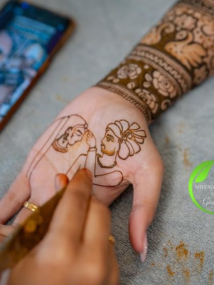 The process of creating a memory. Here you can see me sketching the couple's portrait directly onto the hand, using a photo on my phone as a reference to get every detail just right.