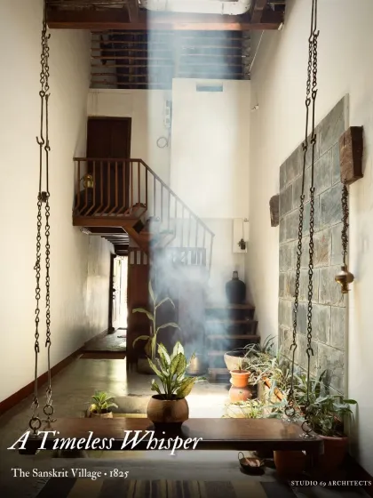 A timeless whisper from the past. In this 200-year-old ancestral home, a beam of light illuminates a space defined by raw materials and quiet contemplation, showcasing our approach to heritage restoration that honors history while creating serene living environments.