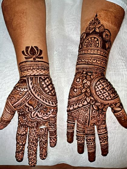 A bold and beautiful design for a wedding guest. The contrast between the filled and empty spaces, along with the lotus motif, makes this design stand out.