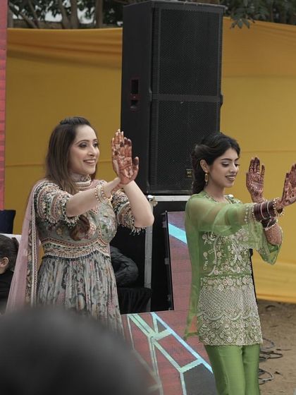 The ladies of the family looking elegant and graceful during their mehendi performance.