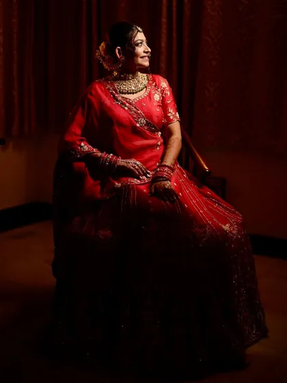 A dramatic, low-light portrait of the bride, creating a regal and timeless image.