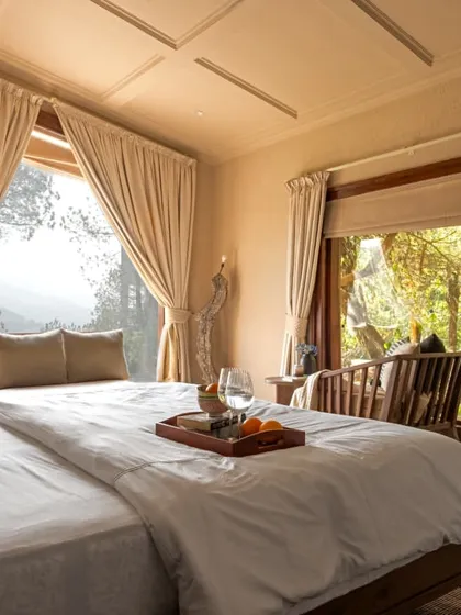 Waking up to this view is what mountain living is all about. We designed the room to ensure the bed has a direct line of sight to the Himalayan landscape, making every morning a breathtaking experience.