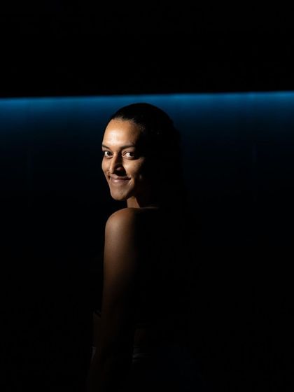 A quiet moment of reflection for one of our instructors. The studio is a place of both high energy and deep focus.