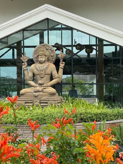 A close-up of the Lord Dhanvantari statue, an embodiment of health and longevity. His presence blesses our retreat and all who come here to heal.