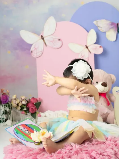 A magical unicorn and butterfly theme for a first birthday. The pastel colors, whimsical props, and dreamy backdrop create a true fairy tale setting.
