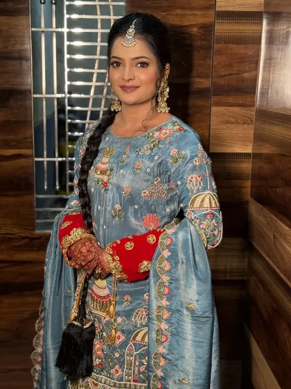 A unique look for a pre-wedding event, featuring a Punjabi-style suit with intricate embroidery.