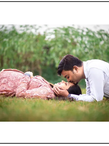 A tender moment shared between the couple, lying in the grass. These relaxed and natural poses result in some of the most heartfelt and authentic photographs.