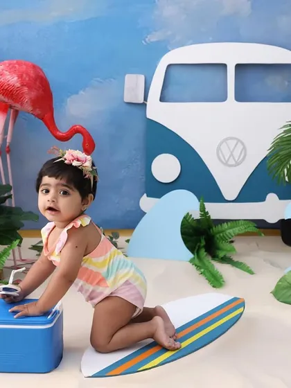 Surfs up! This action shot of the baby on a surfboard is full of personality and fun. It’s a great example of how we can create dynamic and playful images in a themed session.