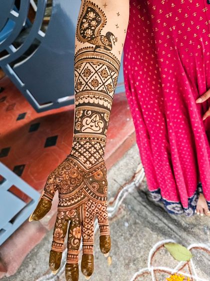 A single arm shot highlighting the peacock and the personalized date.