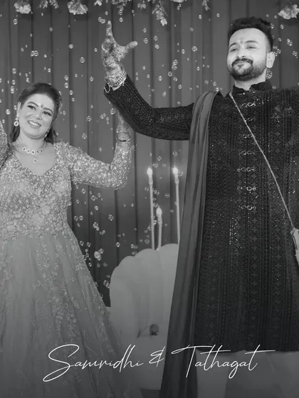 A candid moment of pure joy. This black and white photo captures the couple dancing, surrounded by bubbles, showcasing the fun and celebratory atmosphere we create.