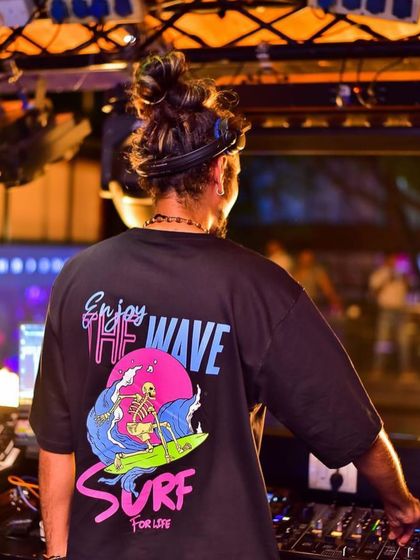 A shot from the back showing off my "Enjoy the Wave" t-shirt. It's a motto I live by, both in life and in my music.