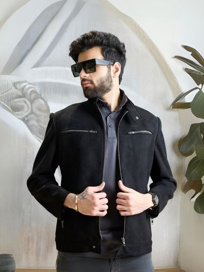 This shot captures the cool, confident attitude of the black biker jacket. It is more than just a jacket; it is a statement of style.