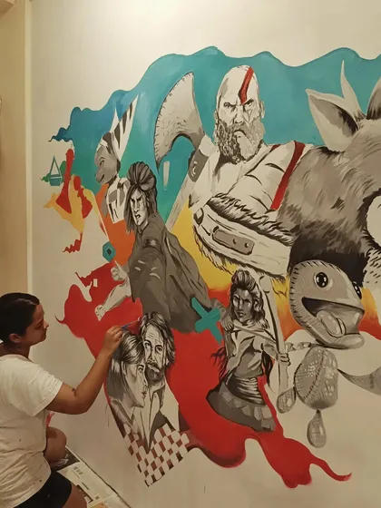 Another view of the painting process, showing how the different elements of the collage start to come together to form a cohesive and exciting scene.