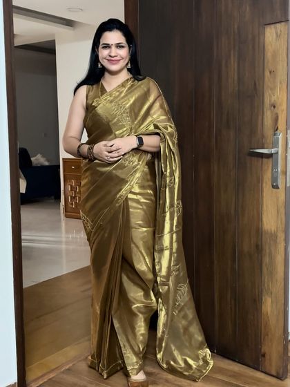 Another look at my golden tissue saree from Deziremore Clothing. The intricate embroidery on this saree is just beautiful.