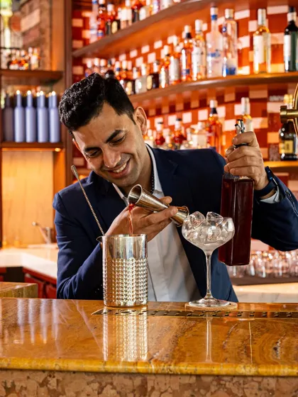 Varun in his element, measuring and mixing with precision. His passion for creating unique flavour combinations is at the heart of our bar program.