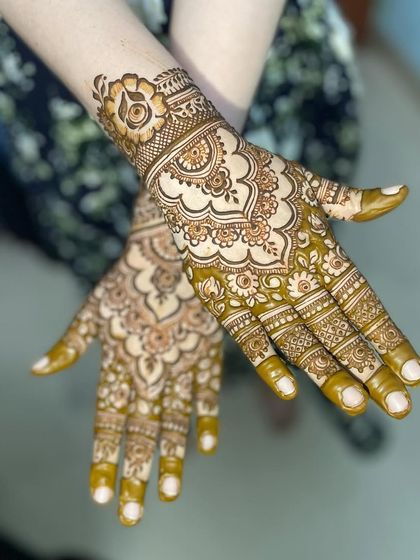 Intricate Full Hand Mehendi photo 9