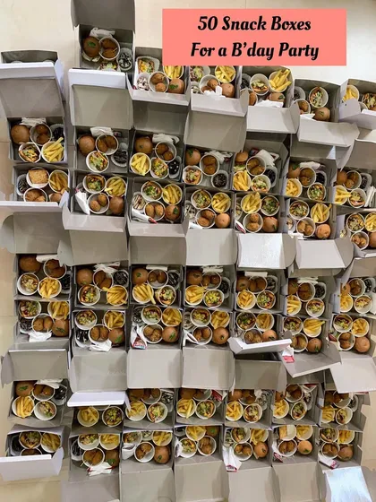 Getting 50 snack boxes ready for a fun-filled birthday party.