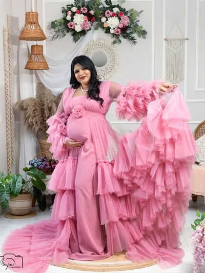 A playful and joyful pose, as she shows off the beautiful movement of the pink gown. Her happiness is contagious.