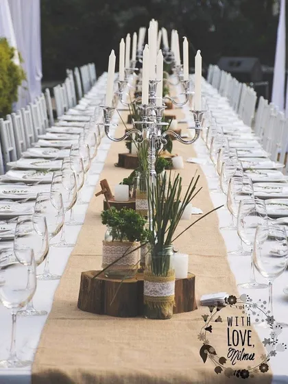 A rustic and elegant long table setup from one of our earlier weddings. This image is part of our 10-year story, showcasing our love for creating beautiful, communal dining experiences.