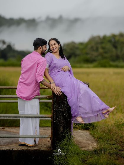 A fun and flirty moment on the bridge railing. These playful poses bring out the couple's personality.
