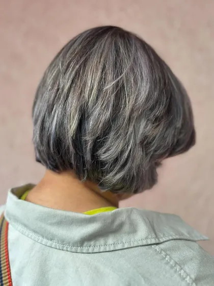 Feeling frosty and fabulous with this gorgeous silver bob. This look requires bleaching the hair to a very light base to achieve this pure, clean silver tone.