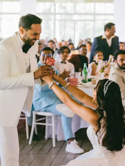 Who says only the groom can go down on one knee? I love breaking traditions, and this moment from the bride's solo performance, where she presents a rose to her groom, was a beautiful and modern expression of her love.