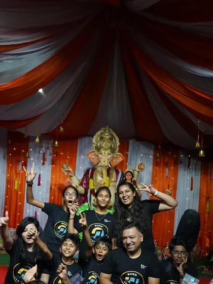 Our performers and I pose for a group photo in front of the Ganesh idol after a successful show. These events build camaraderie and give our students invaluable experience performing for a live audience.
