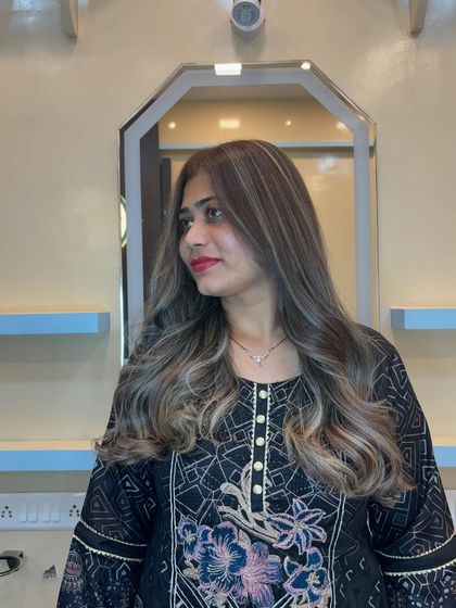 After the transformation. I corrected the previous color and created this beautiful ash blonde balayage. The waves add movement and show off the seamless blend of the highlights.