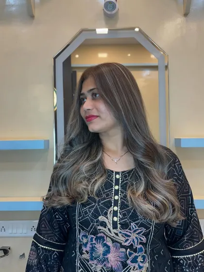 After the transformation. I corrected the previous color and created this beautiful ash blonde balayage. The waves add movement and show off the seamless blend of the highlights.