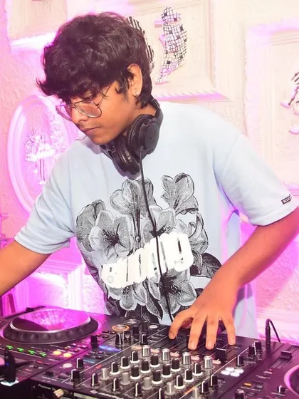 Another shot of me focused on the Pioneer DJ decks. Every adjustment to the EQ and every transition is done to build and maintain the party's energy.